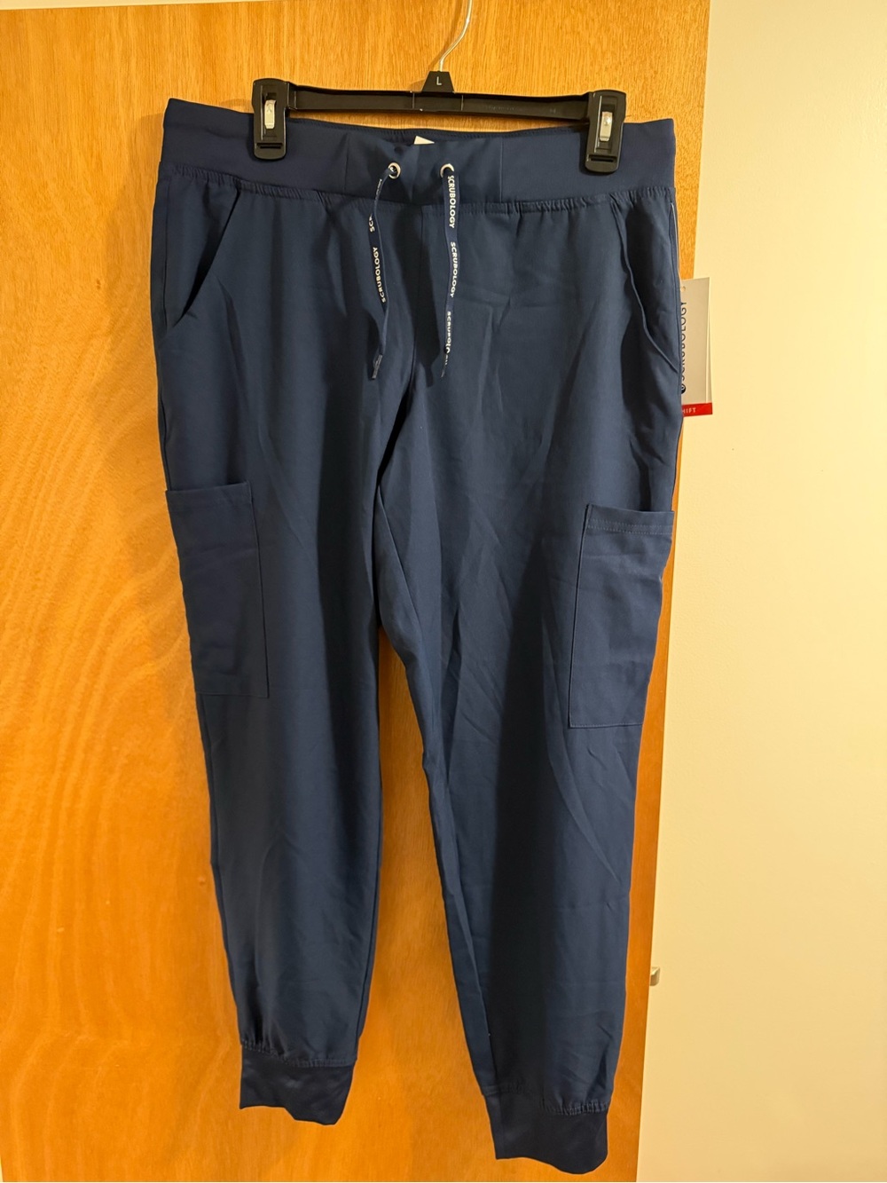 Navy blue Scrubology jogger pants in size M